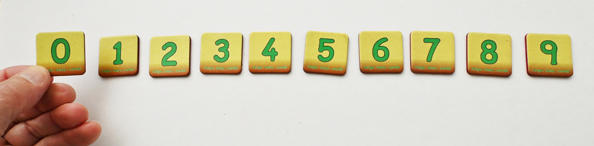 One set of teign digit cards arranged in order, and in a line, with zero on the left