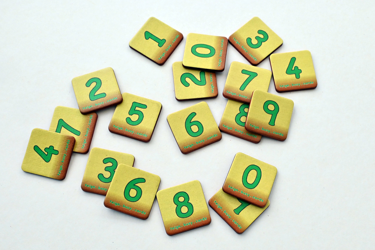 Two sets of ten digit cards lying at random on a table top