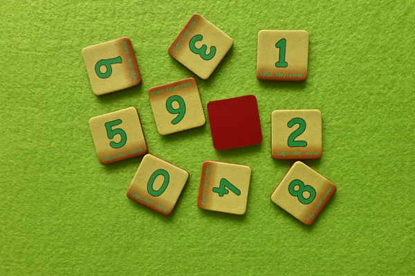 Ten digit cards are lying on the table ~ one of them is upside down. What number digit is the unseen one?